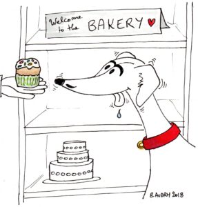 Hungry dog with bakery treats